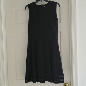 Calvin Klein Black Dress with Peekaboo sheer hem, Size 10.